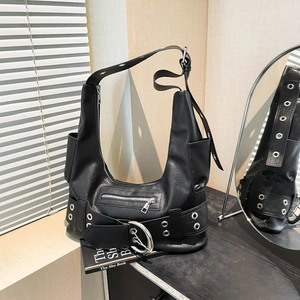 Detailed close-up of a black motor-style bag with silver metal eyelets and buckles
