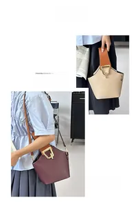Dettaglio borse a secchiello beige e bordeaux in pelle martellata con chiusura dorata