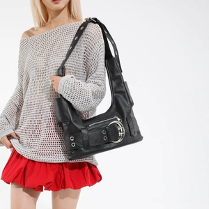 Y2K style black motorcycle hobo bag with silver buckles and metal eyelets decoration