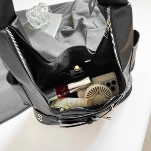 Chic black motorcycle tote bag with silver hardware showing spacious interior storage