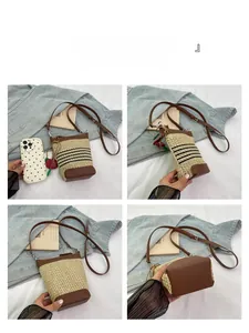 Detail view of mini raffia bucket bag with brown leather base and phone size comparison