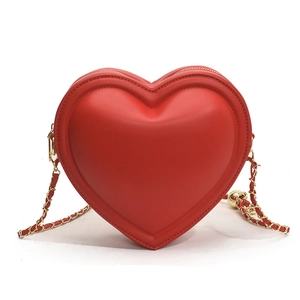 Chic red heart-shaped crossbody bag with gold-tone chain strap on white background