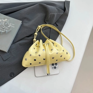 Fashionable yellow studded dumpling bag with drawstring and shoulder strap for women