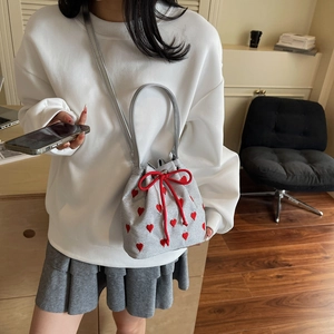 Silver bucket bag with red heart embroidery and drawstring closure for women