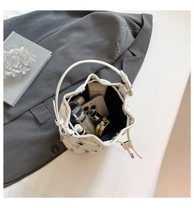 Top view of the white bucket bag interior showing spacious capacity for phone and cosmetics