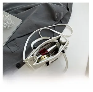Interior view showing the large capacity of the white leather tote bag for essentials