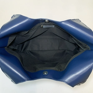 Large dark blue nylon bucket tote bag with magnetic closure and spacious interior