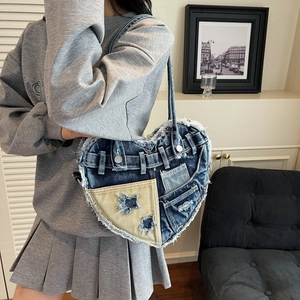 Y2K heart-shaped denim patchwork shoulder bag with star details and distressed fringe