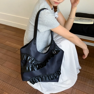 Large black nylon bucket tote bag with layered ruffle trim for summer casual commute