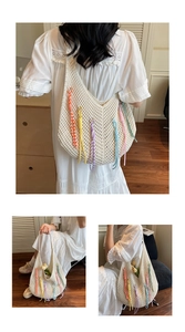 Detailed knit crochet tote with vibrant multi-color tassels and bohemian fringe accents