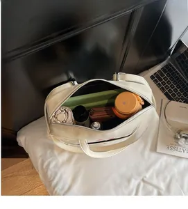Interior view showing the large capacity of the white PU leather tote bag with daily items