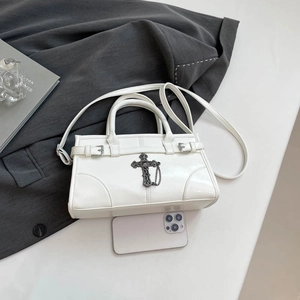 Minimalist white leather Boston bag with vintage silver cross and chain detailing