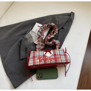 Detail of plaid tote bag with heart patch, Gugiigugii embroidery and scrunchie strap
