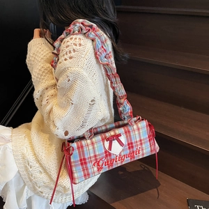Plaid canvas tote bag with heart patch and ruffled shoulder strap in a warm autumn setting