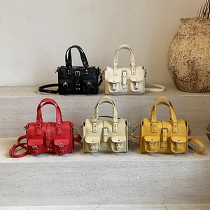Moto-style rivet handbags in five colors with studded pockets and detachable straps