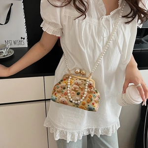 Cute beige canvas shell bag with teddy bear embroidery and pearl crossbody chain strap