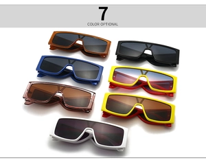 Flat lay of rectangular oversized sunglasses in seven stylish colors with V-shaped metal trim