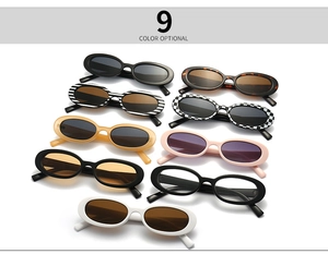 Flat lay of small oval frame sunglasses showing 9 optional color variations and patterns