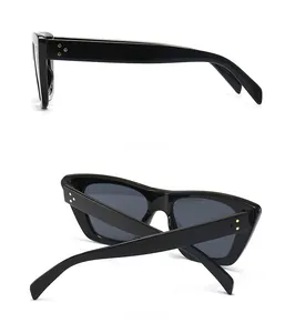Detail view of retro square flat top sunglasses with gold triple rivet accents on the side