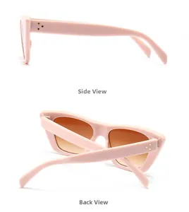 Detail of pink flat top sunglasses featuring golden rivets and brown gradient lenses