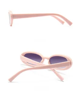 Side and back view of light pink oval sunglasses with gradient lenses in high detail