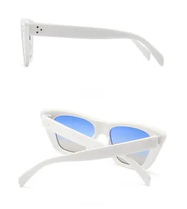 Detailed side and back view of white cat-eye sunglasses with golden triple rivets