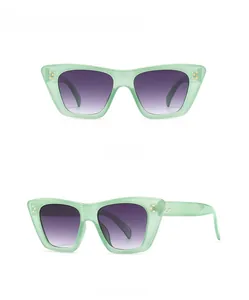 Front and side view of cat eye sunglasses in green acetate with purple gradient lenses