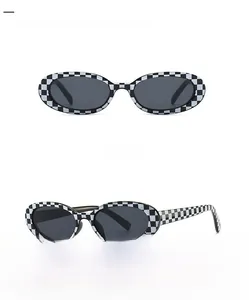 Front and side view of small oval sunglasses with black and white checkered pattern