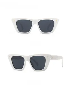 Detailed views of white flat-top cat eye sunglasses with metal rivet accents