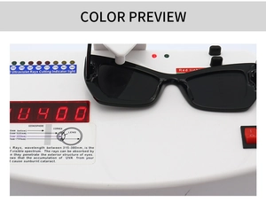 Detailed view of black cat-eye sunglasses undergoing UV400 protection testing on a device