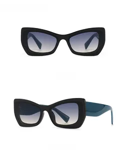 Front and 45-degree side view of black cat-eye sunglasses with gradient blue lenses