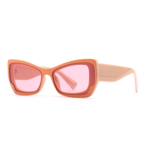 Retro butterfly cat eye sunglasses with orange and fuchsia frame and pink lenses