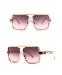 Detailed front and side view of pink oversized sunglasses with gold striped temple accents