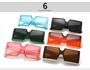 Flat lay view of six colorful square oversized sunglasses with gradient lenses
