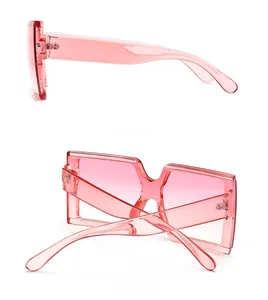 Detail view of pink square sunglasses showing sturdy metal hinges and side profile