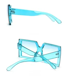 Side and back view of light blue square sunglasses with thick transparent frames
