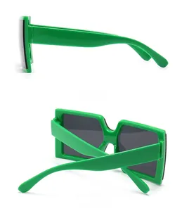 Detail view showing side and back profile of square green jelly fashion sunglasses