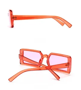 Detailed side and back view of narrow rectangle sunglasses in translucent orange PC frame