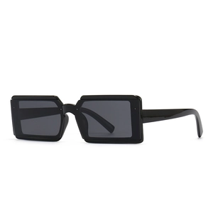 Modern rectangular black frame sunglasses with dark lenses for fashion street photography