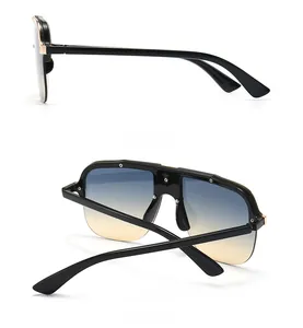 Detailed side and back view of oversized flat top sunglasses with gold metal accents
