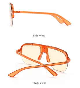 Detail view of orange oversized flat top sunglasses showing side and back hinge structure