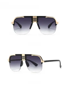 Detailed front and side views of black oversized flat top sunglasses with gold metal trim