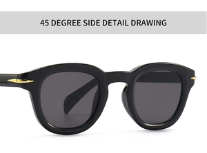 Close-up of retro round sunglasses with golden arrow metal accents on black frame