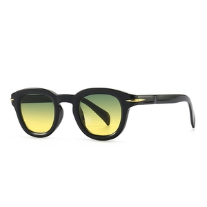 Retro round black sunglasses with yellow-green gradient lenses and gold arrow hardware