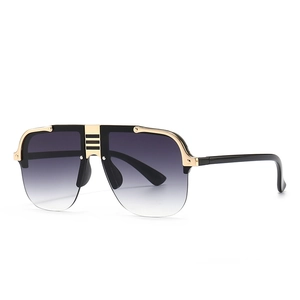 Modern oversized flat top pilot sunglasses with gradient grey lenses and gold metal accent