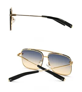 Détail des lunettes pilote en alliage doré avec verres dégradés bleu et orange