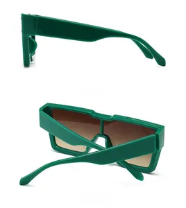 Detailed side and back view of emerald green oversize sunglasses with gradient brown lenses