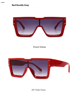Front and side view of red oversized sunglasses with gradient lenses and gold studs