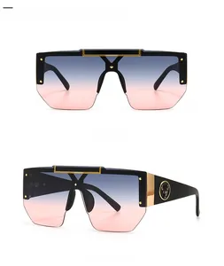 Detail view of square oversized sunglasses with gradient lenses and metal deer logo