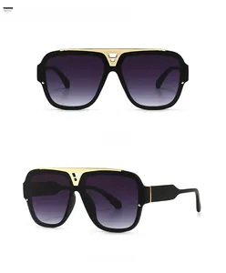 Detailansicht der Retro-Oversized-Sonnenbrille mit goldenem V-Steg und Verlaufsgläsern